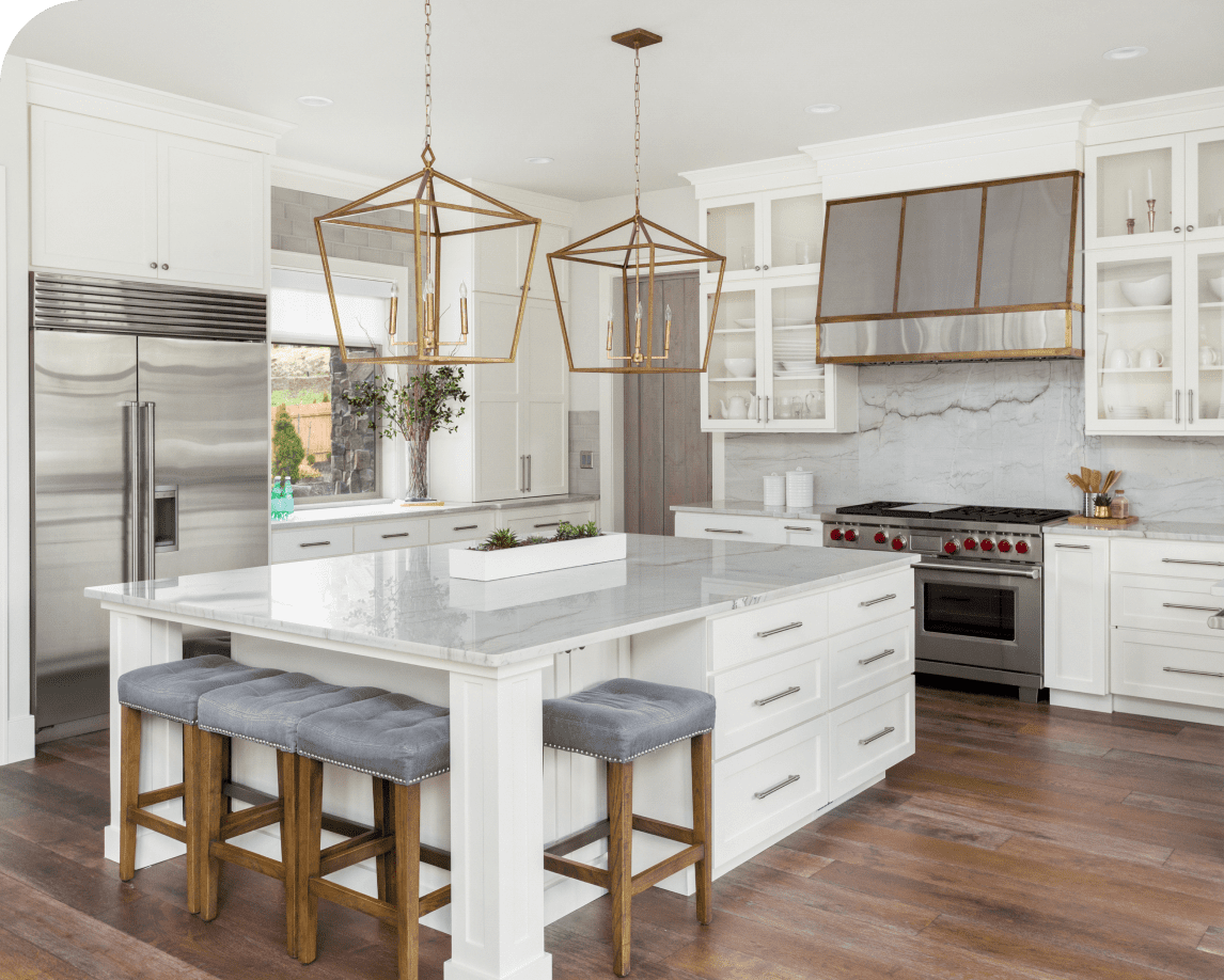 Modern kitchen with white cabinets and island.