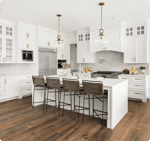 Modern white kitchen with island and stools.