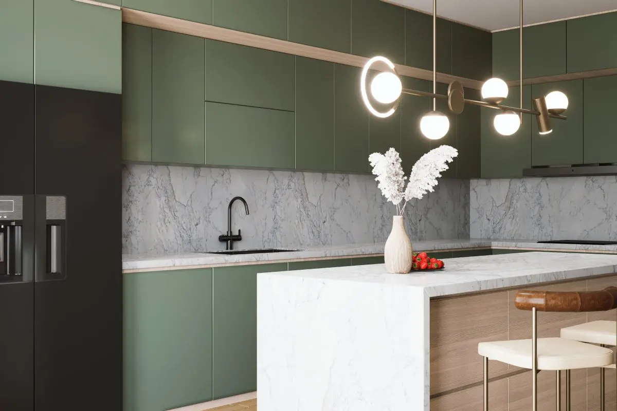 Modern kitchen with marble island and lighting.